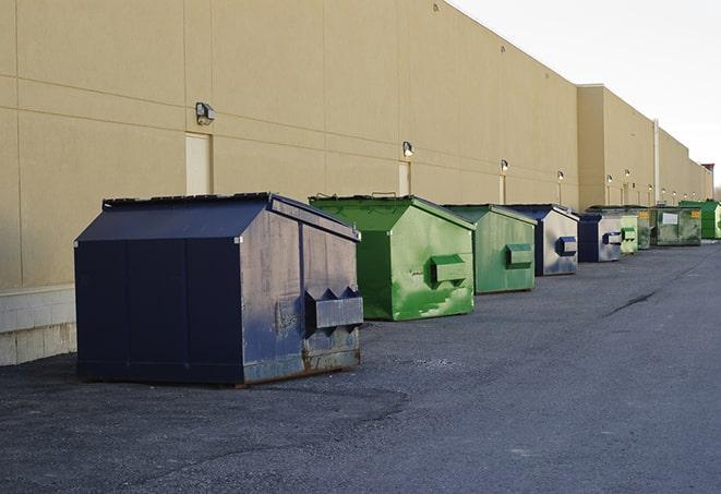 a stack of yellow construction dumpsters on a job site in Burnsville